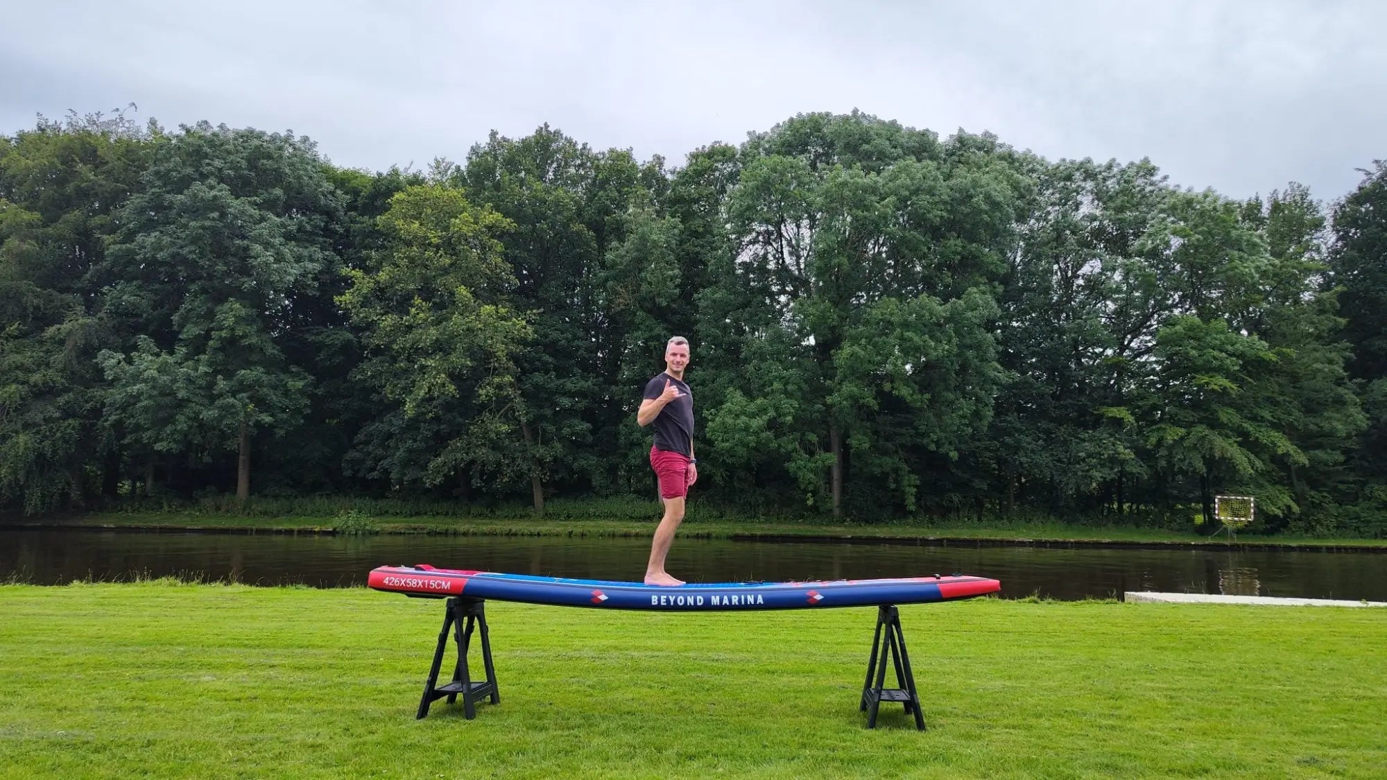 Inflatable paddleboard on sawhorses showcased in Race Uno Series review by Beyond Marina