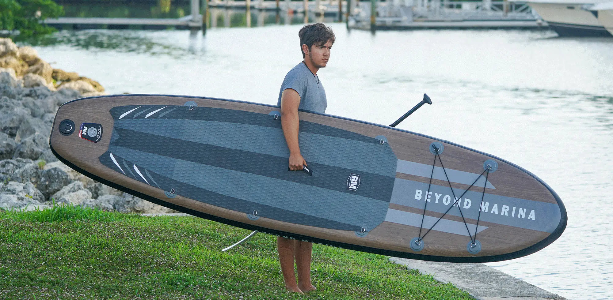 Beyond Marina wooden series paddle board on water, highlighting elegance and performance.